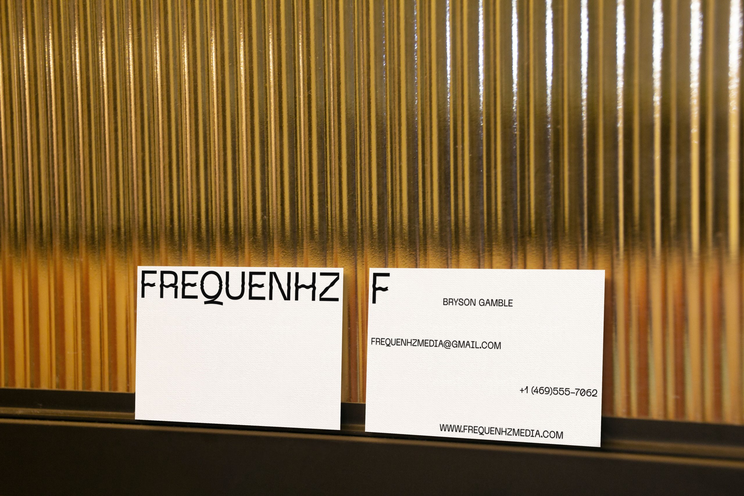 frequenhz realistic business card in a yellow background