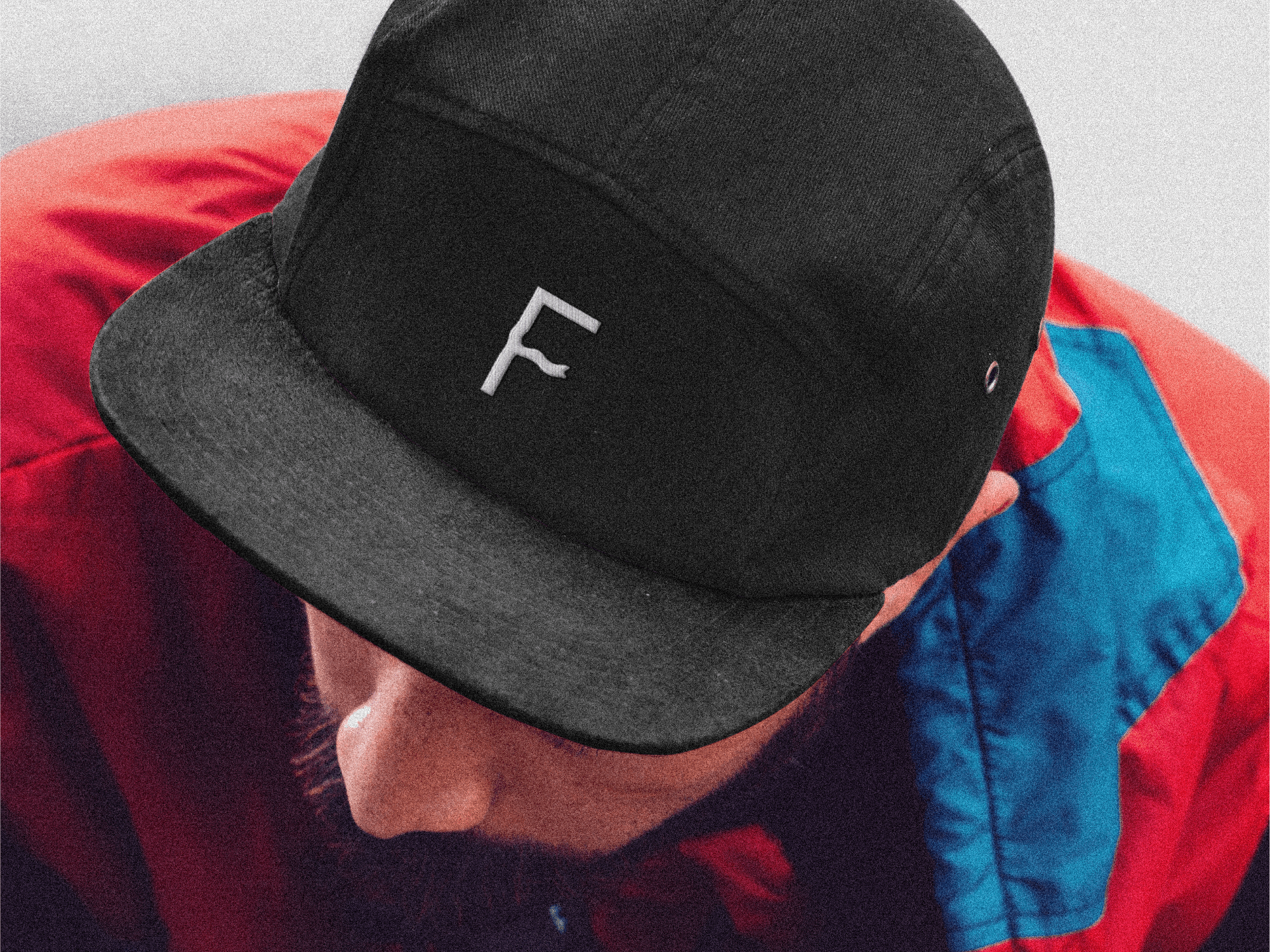 frequenhz letter mark in a black cap