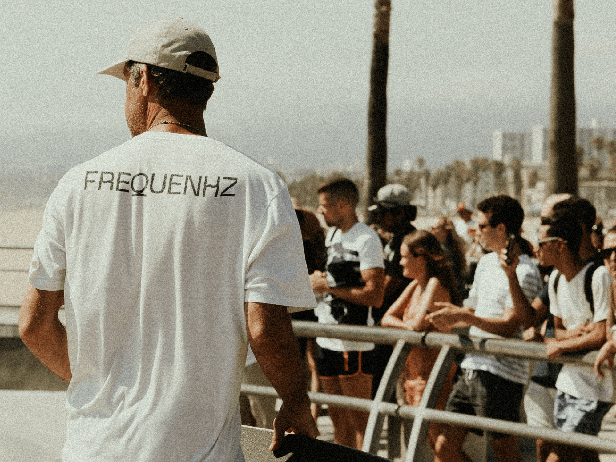frequenhz logotype in a white t-shirt of a skater